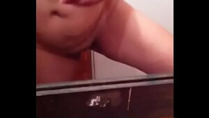 Chubby girl from Costa Rica masturbates in front of the mirror and gets her whole hand wet