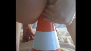 Sitting backwards on a traffic cone