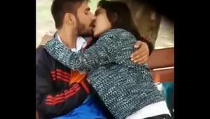 Couple caught kissing in the park